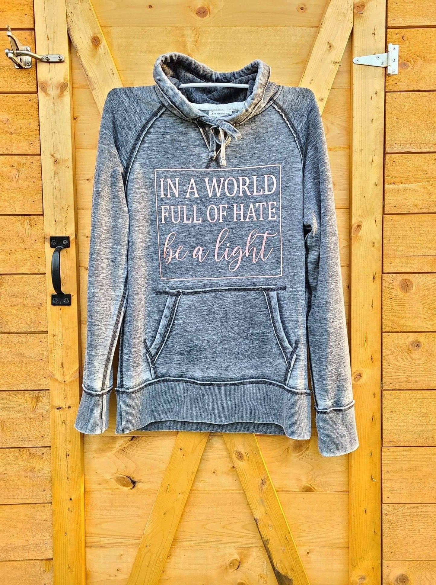 In A World Full of Hate Be The Light Distressed Unisex Distressed Vintage Hoodie
